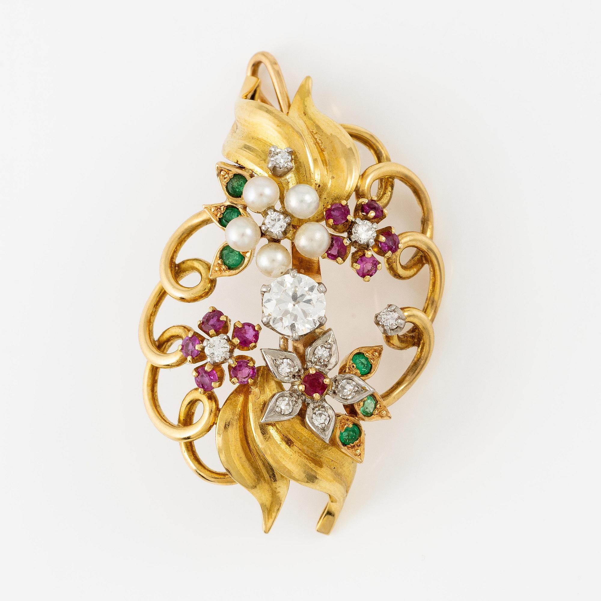 A Strömdahls bracelet/pendant combination in 18K gold with rubies, emeralds, pearls and diamonds.