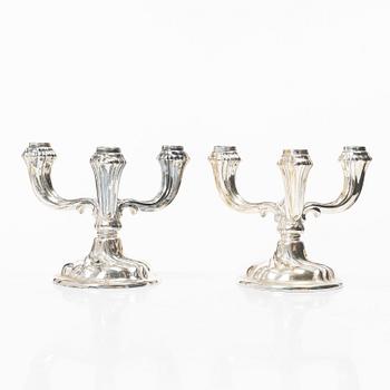 A pair of German silver candelabra, mark of Jakob Grimminger, Schwäbisch Gmünd, 20th century.