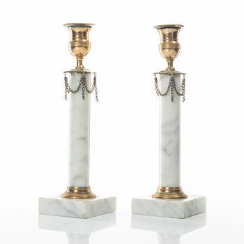 A pair of gilt-brass and marble late Gustavians candlesticks, late 18th century.