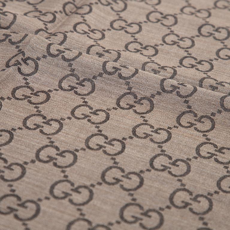 Gucci, a wool and silk mix 'GG' jaquard shawl.