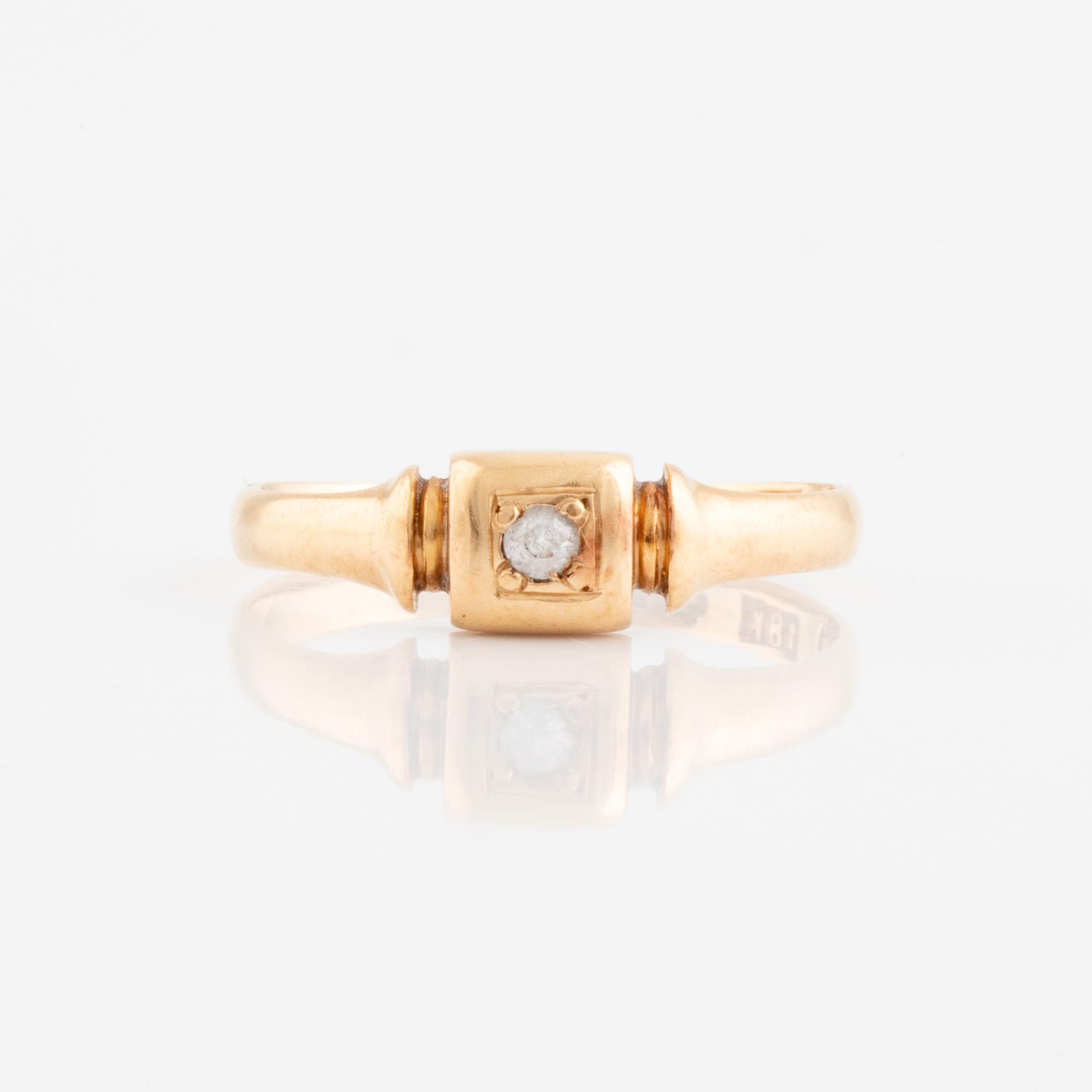 Faceted white stone ring.