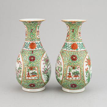 A pair of famille rose canton vases, early 20th century.