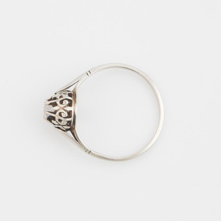 A ring set with a transitional-cut diamond.