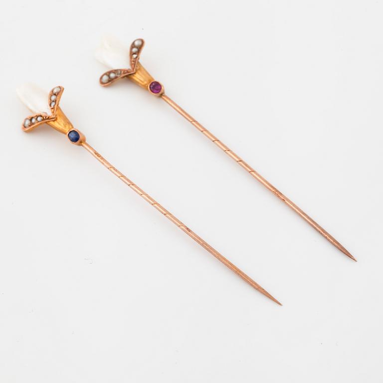 Two pins set with cultured pearls and a synthetic ruby and a synthetic sapphire.