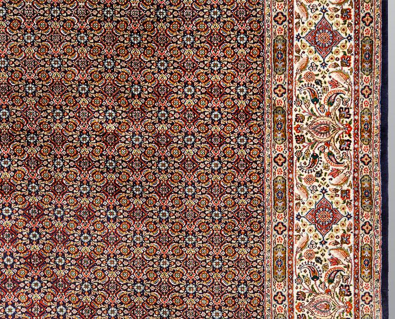 A Moud part silk carpet, signed, 335 x 250 cm.