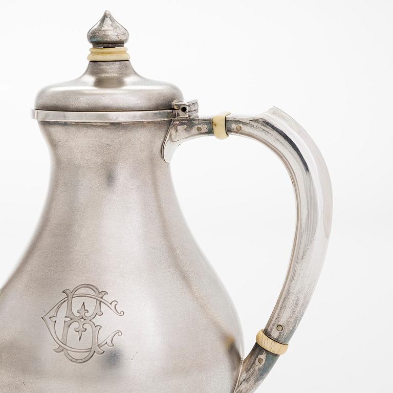 A four-piece silver coffee set, St. Petersburg 1887, original fitted box from Khlebnikov. Sugar tong, Moscow around 190.