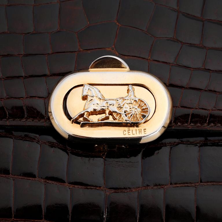 CÉLINE, a brown crocodile evening bag / shoulder bag with  shoulder strap.