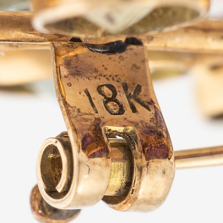 Brooch, 18K gold with citrine, amethyst, and tourmaline among others.