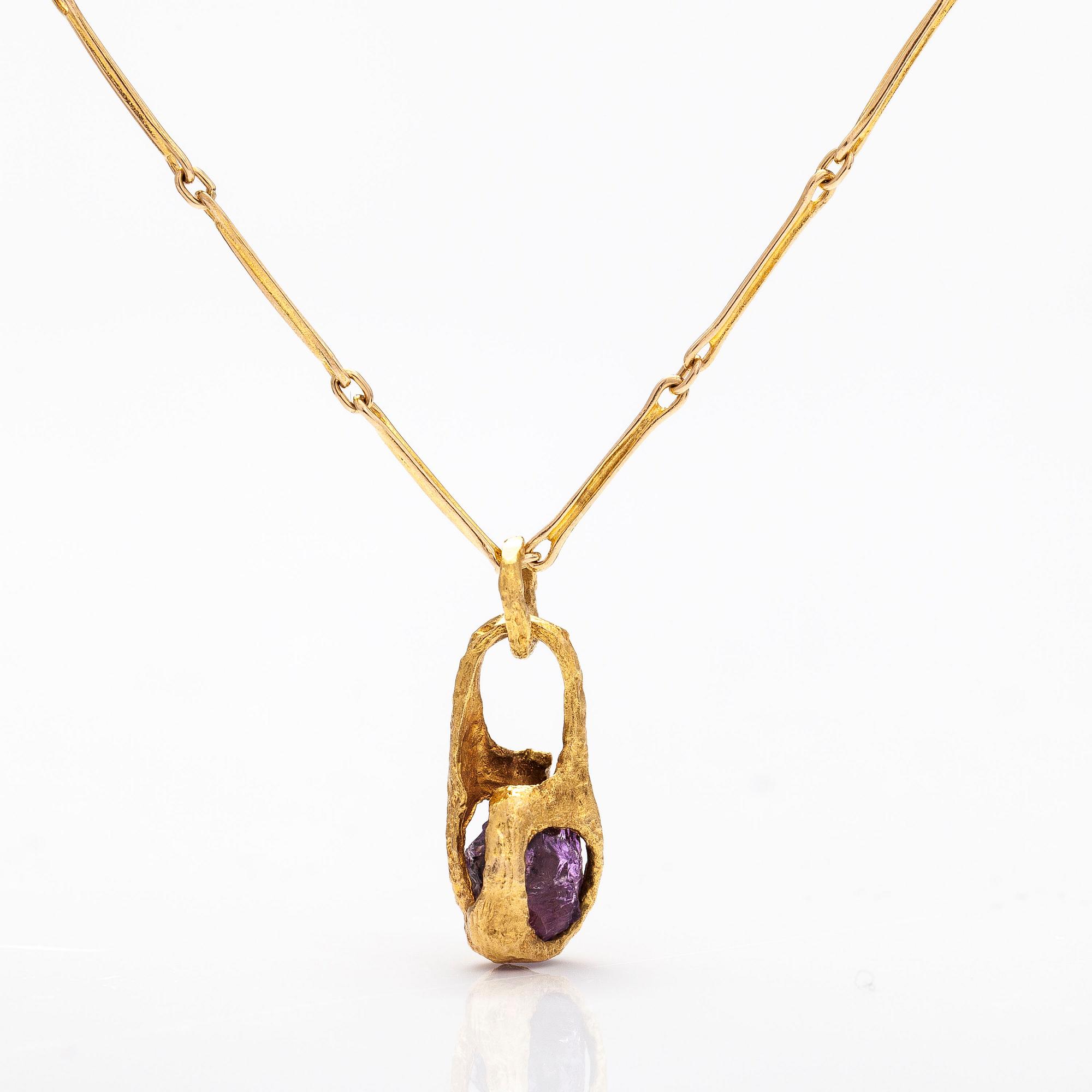 BJÖRN WECKSTRÖM, A 14K gold pendant "Reindeer clock" with an amethyst and chain "Raito". Lapponia 1978  and 1982.