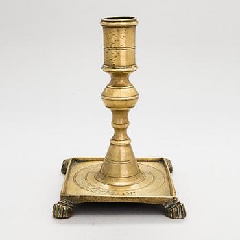 A late 17th century Spanish brass candlestick.