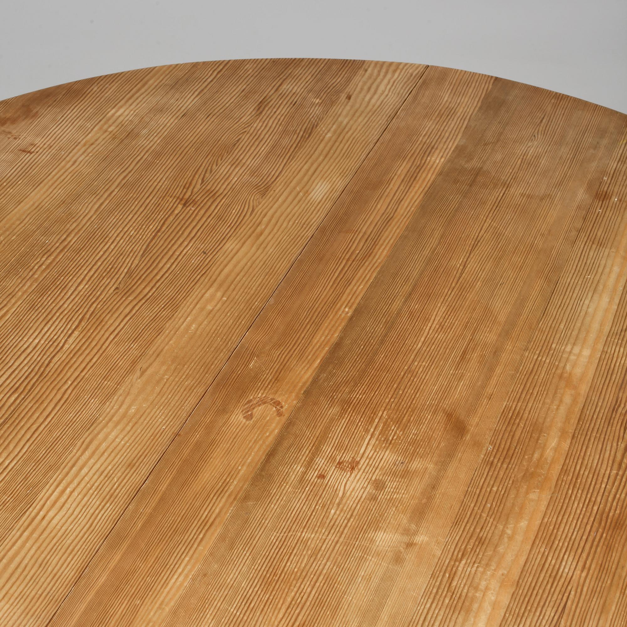 A stained pine dining table, attributed to Axel Einar Hjorth, Nordiska Kompaniet, 1930's.