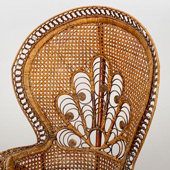 A RATTAN ARMCHAIR.
