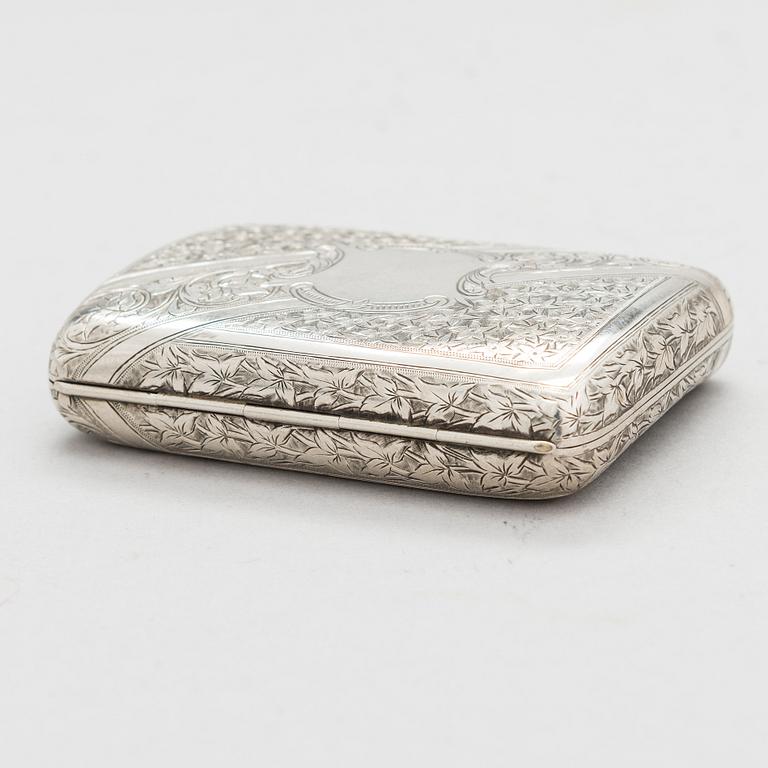 An English sterling silver cigarette case, maker's mark William M. Hayes, of Birmingham, 1896.