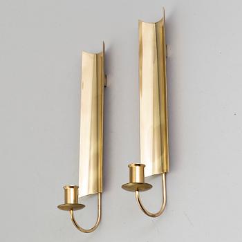 a pair of Pierre Forssell brass wall sconces, Skultuna.