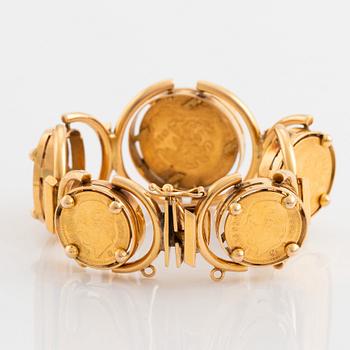 An 18K gold bracelet set with Mexican 22K gold coins.