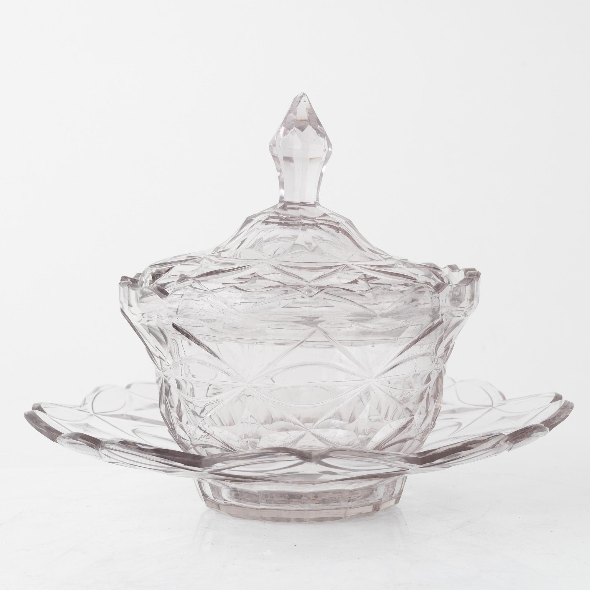 A pair of lidded glass bowls with stands, late 19th century.