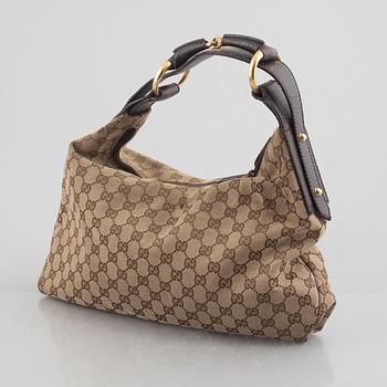 Gucci, a handbag.
