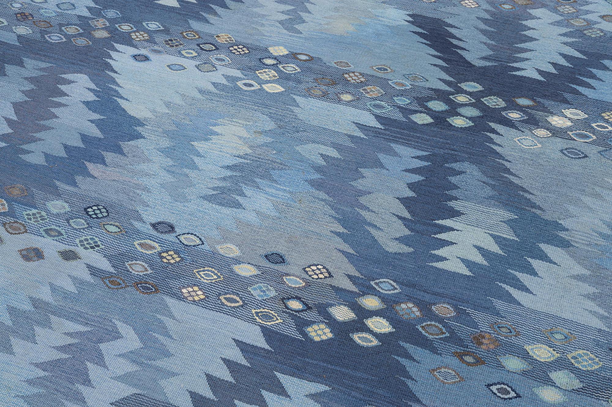 Barbro Nilsson, a carpet, 'Tånga mellanblå', flat weave, c. 350 x 252 cm, signed AB MMF BN.