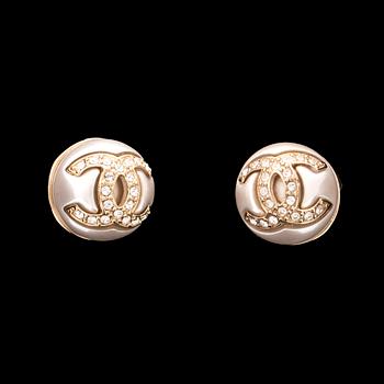 A pair of Chanel earrings.