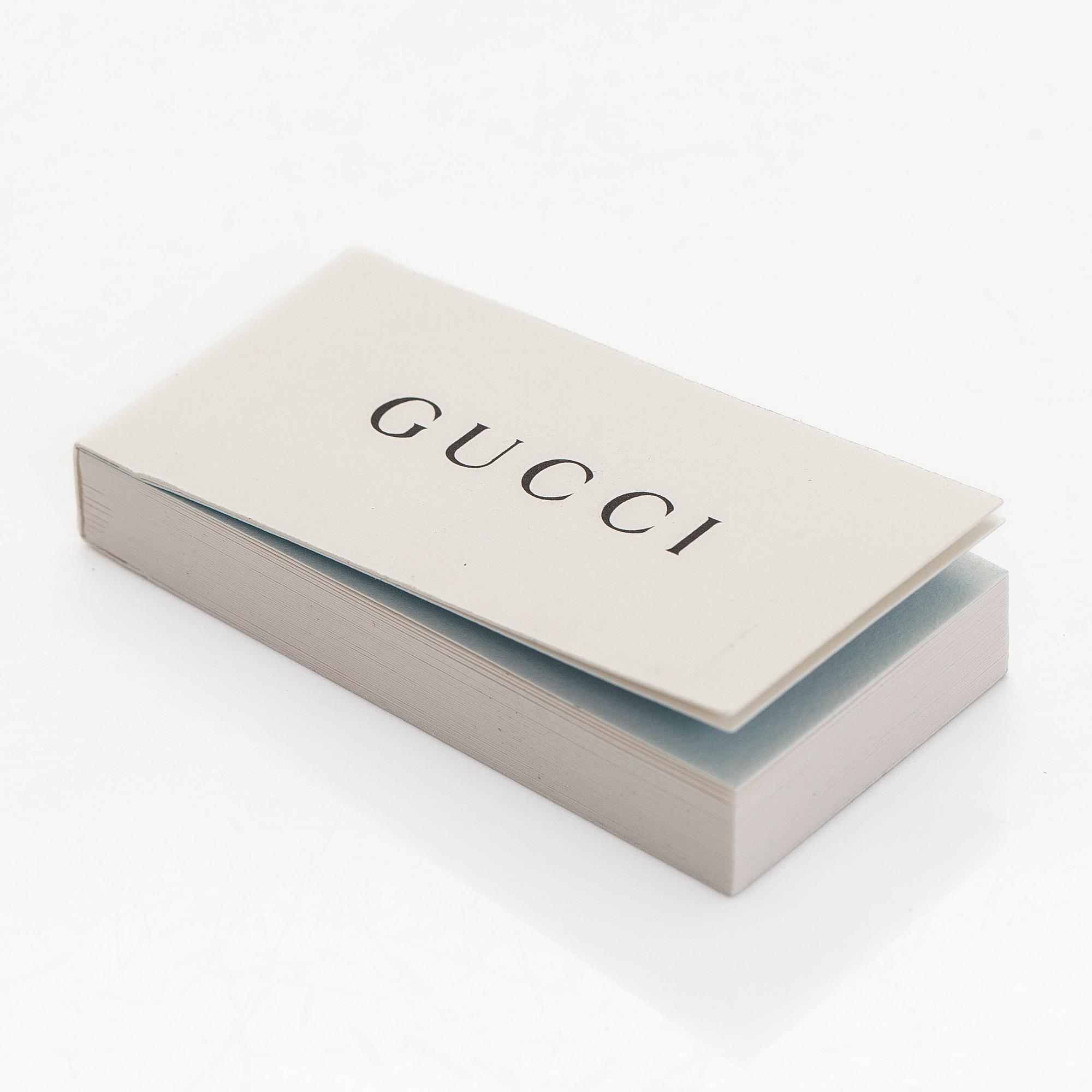 Gucci, sormus, "GG Running Charm", 18K valkokultaa ja timantteja.