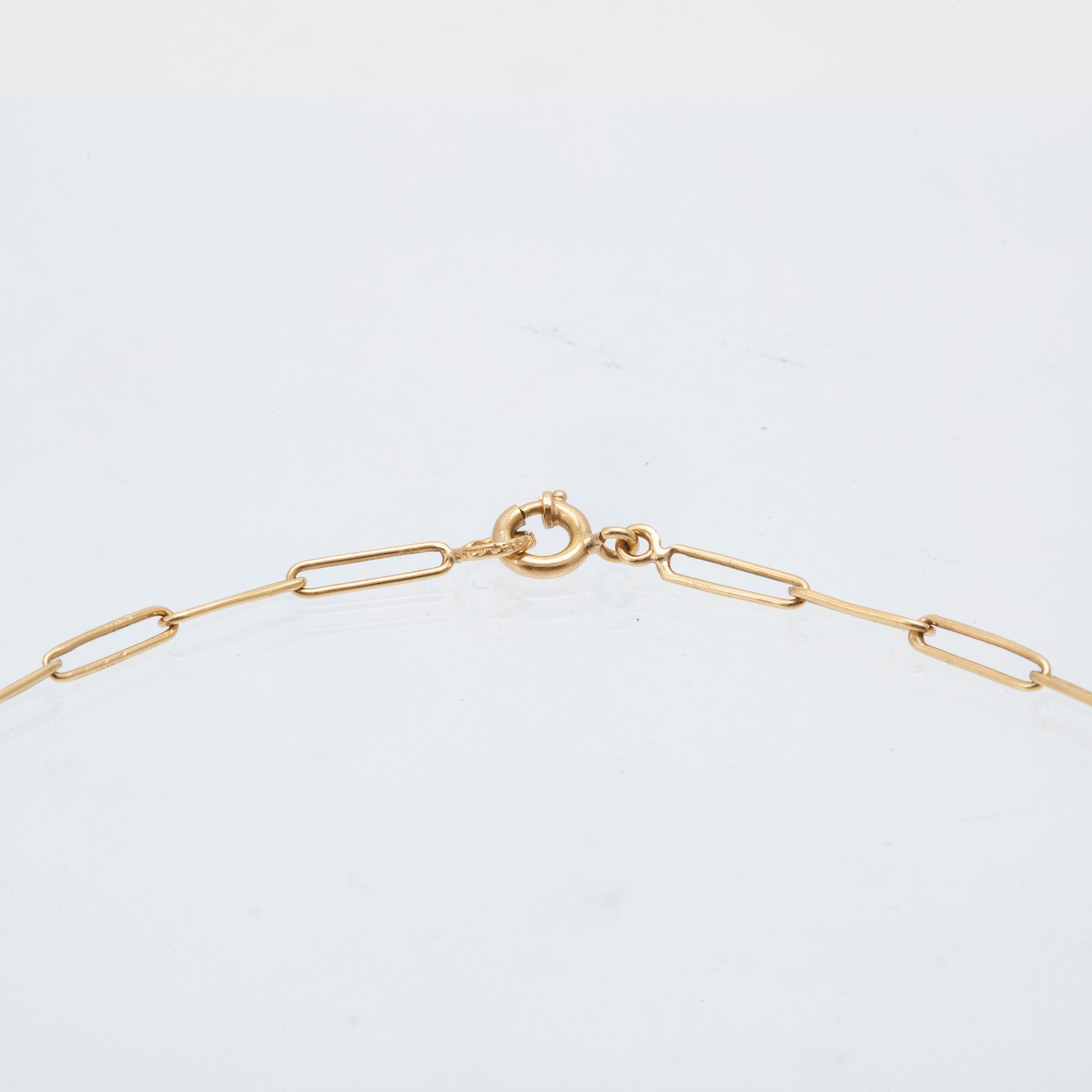 An 18K gold neckalce and a pair of earring set with green stones.