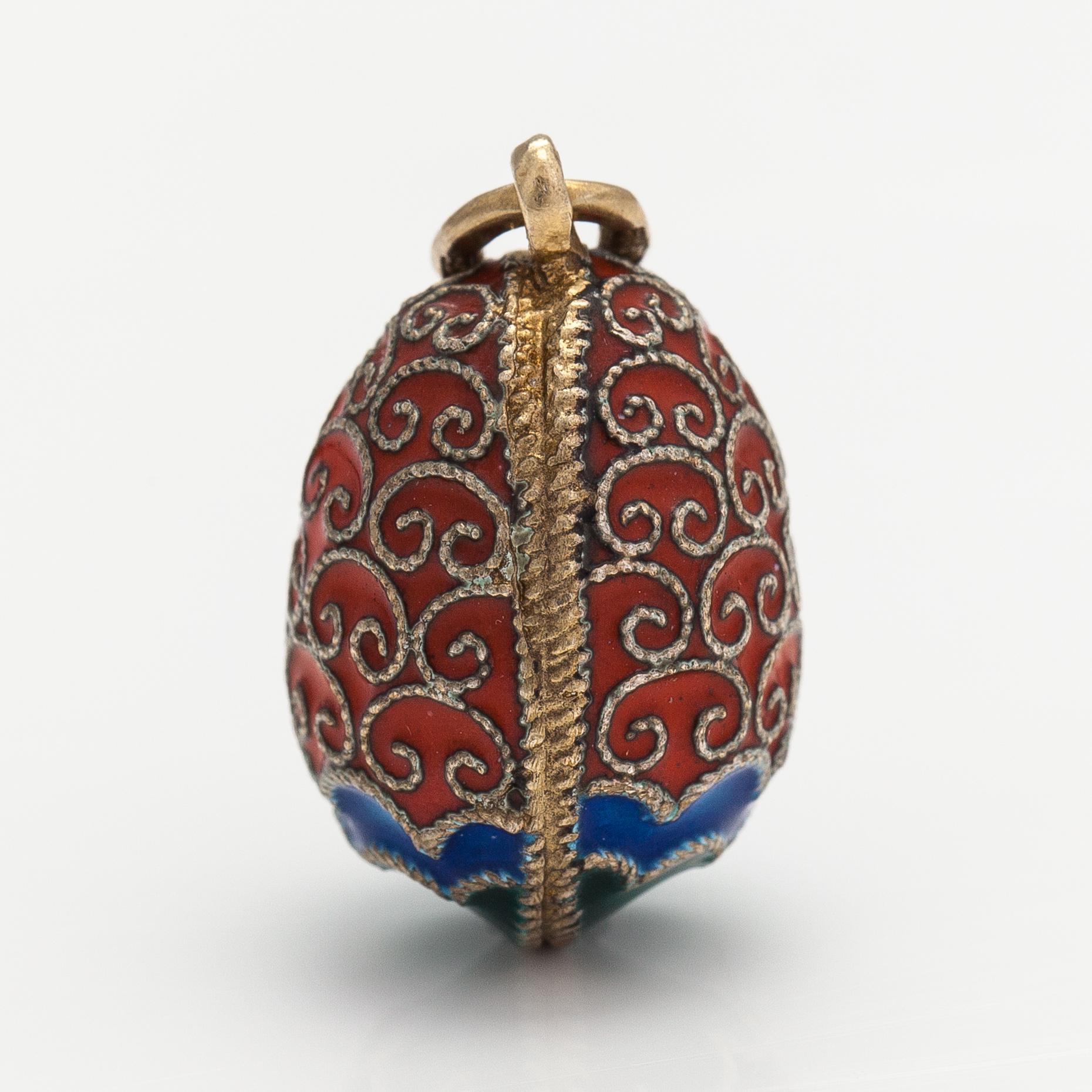 An egg pendant made of sterling silver and enamel. Import marked Kultakeskus, Helsinki.