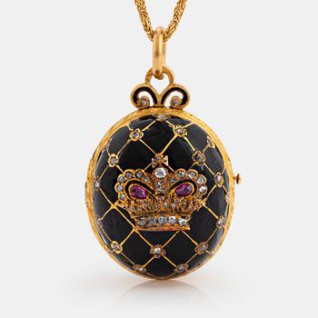 1110. An egg shaped locket in 18K gold and black enamel set with rose-cut diamonds and rubies.