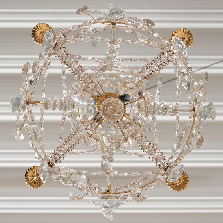 A Gustavian gilt-brass and cut-glass four-branch chandelier by O. Westerberg (master in Stockholm 1769-1881), dated 1795.