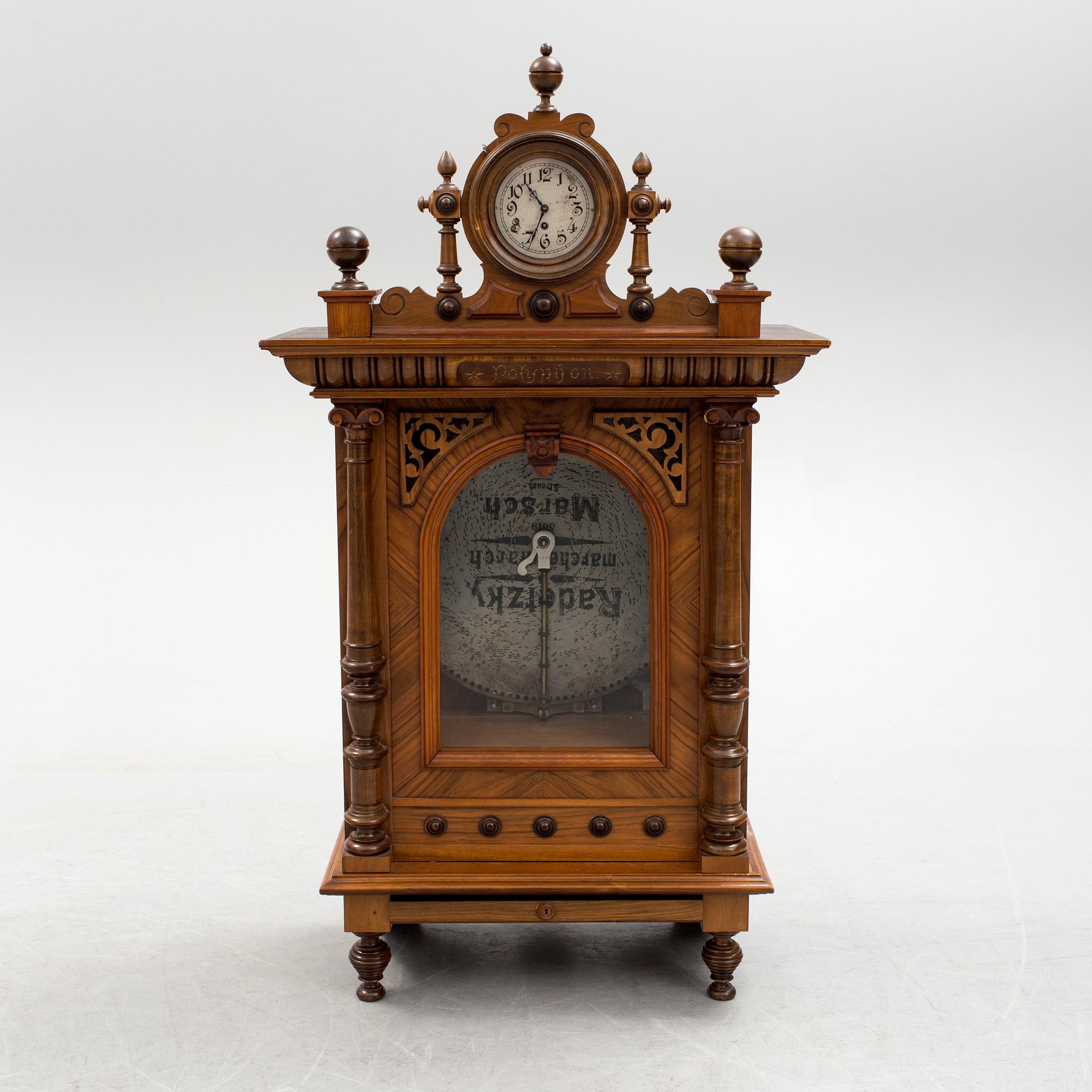 Polyphone with clock in walnut case, late 19th Century.