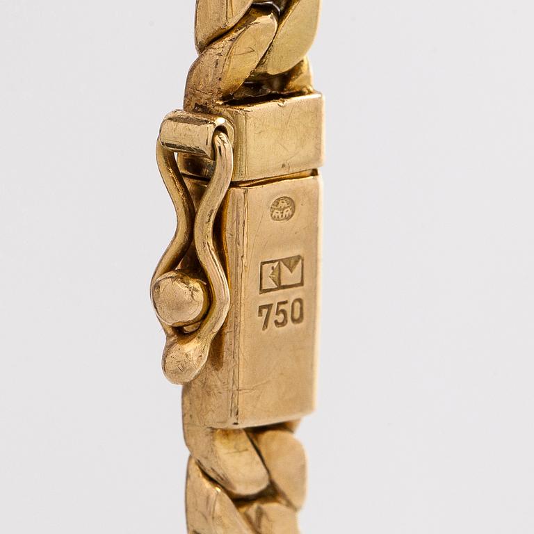 Collier, 18K guld och en briljantslipad diamant.