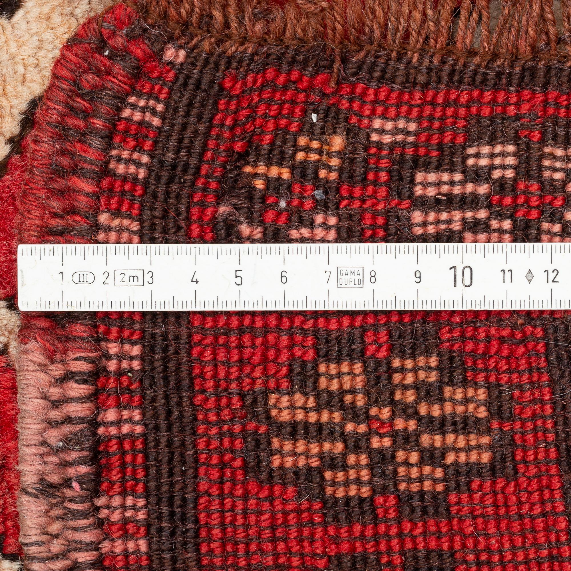 An oriental semi antique carpet, circa 272 x 120 cm.