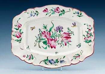 1402. A French Rococo faience serving dish, 18th Century.