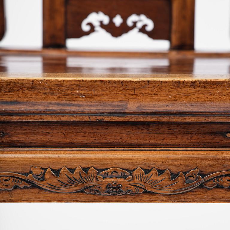 A pair of hardwood armchairs, late Qing dynasty.
