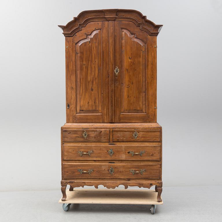 a 1700's Rococo pine cabinet.