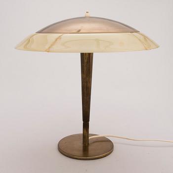 PAAVO TYNELL, A 1940s/1950s model 5061 brass and opaline glass table light.