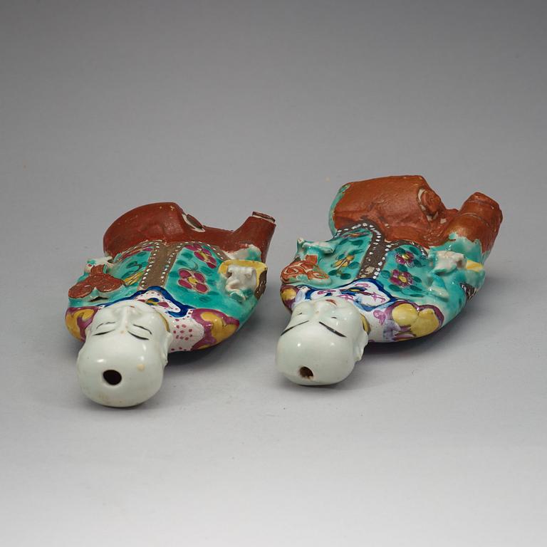 Two famille rose "laughing boys", Qing dynasty, circa 1800.