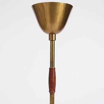 Carl-Axel Acking, a brass and leather floor lamp, designed for the Stockholm Association of Crafts in 1939.