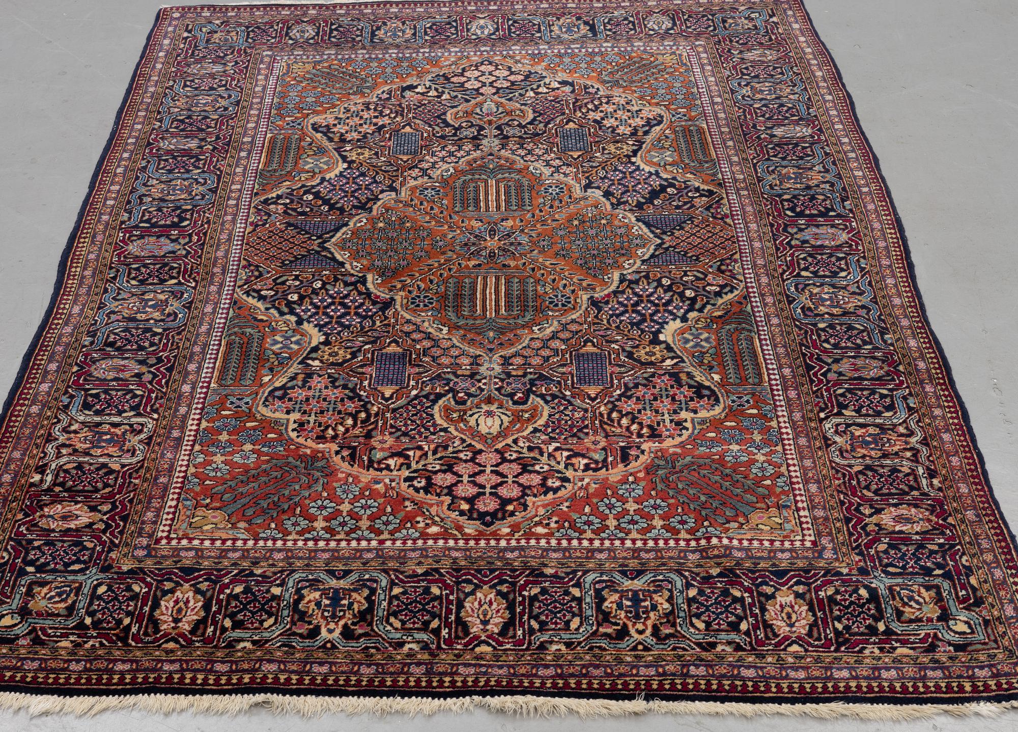 A rug, semi-antique Kashan, ca 216,5 x 140 cm.