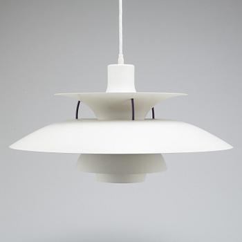 A Louis Poulsen PH -5 ceiling lamp.