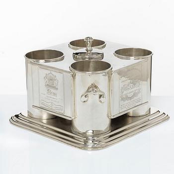A silver plated four-bottle wine cooler.