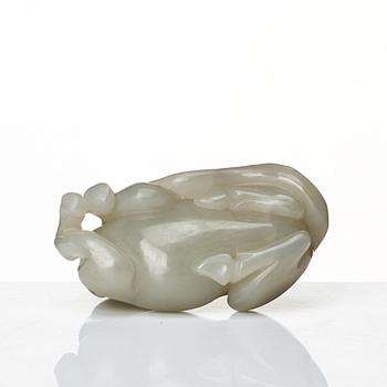 A carved nephrite figure of a reclining horse, Qing dynasty.