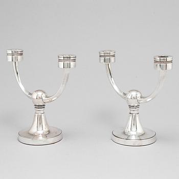 A pair of silver candelabra from MGAB, Uppsala, 1969-71.