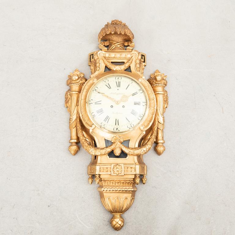 Wall clock in the Gustavian style, first half of the 20th century.