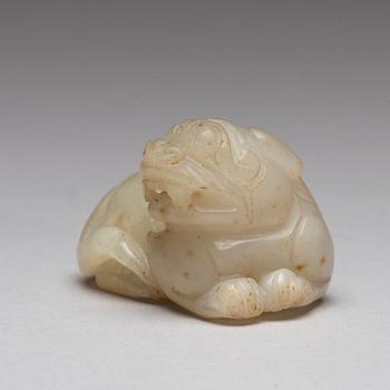 A Chinese nephrite snuff bottle, pendant and figurine.