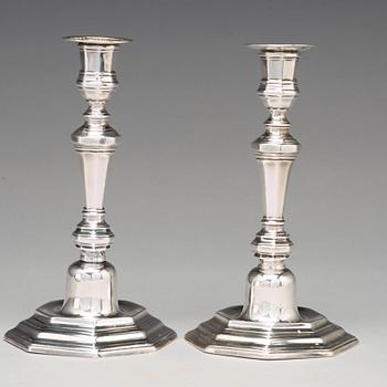 A pair of European 18th century silver candlesticks, unidentified makers mark.
