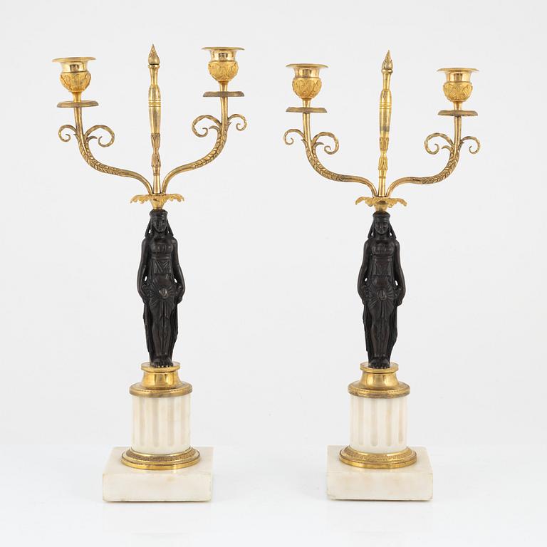 A pair of French Louis XVI two-light marble and ormolu candelabra, late 18th century.