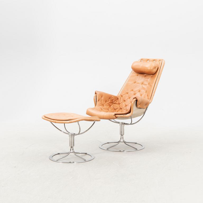 A Bruno Mathsson Jetson leather easy chair and stool later part of the 20th century.