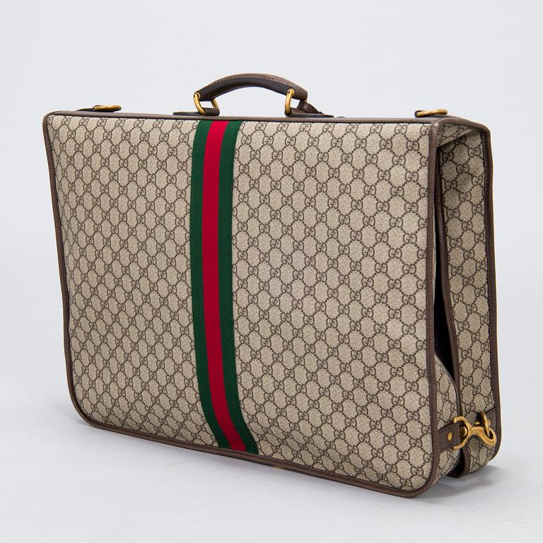 Gucci, a 'Savoy' garment bag.