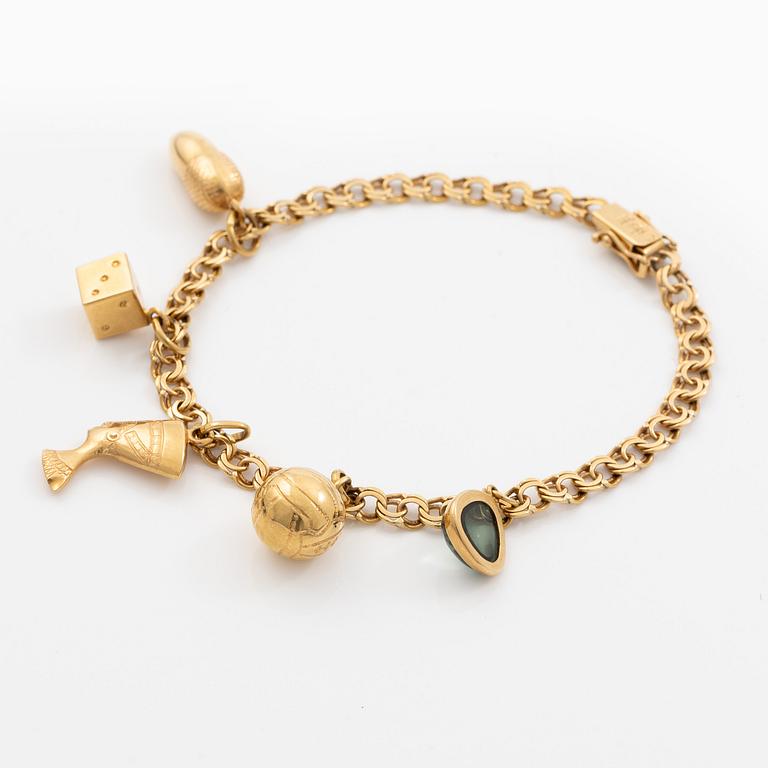 Bracelet 18K gold with five charms.