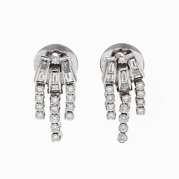 A pair of 18K white gold earrings set with baguette-cut and brilliant-cut diamonds.